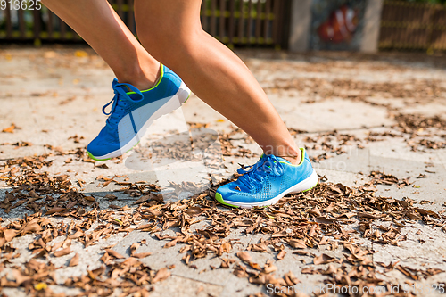 Image of Woman jogging in a park