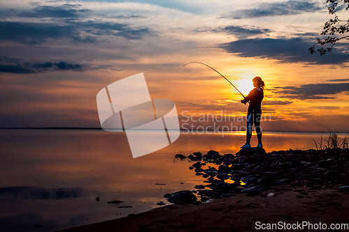 Image of Woman fishing on Fishing rod spinning in Finland