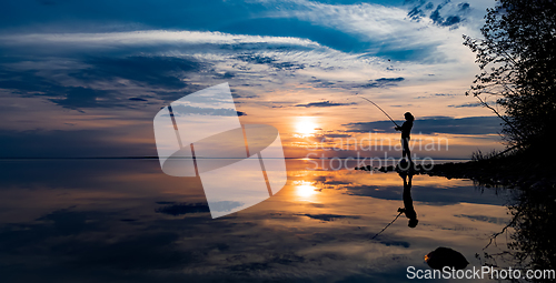 Image of Woman fishing on Fishing rod spinning in Finland
