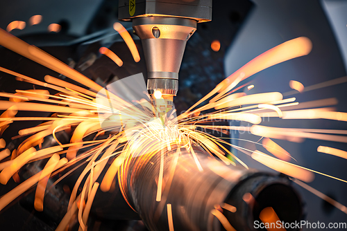 Image of CNC Laser cutting of metal, modern industrial technology.