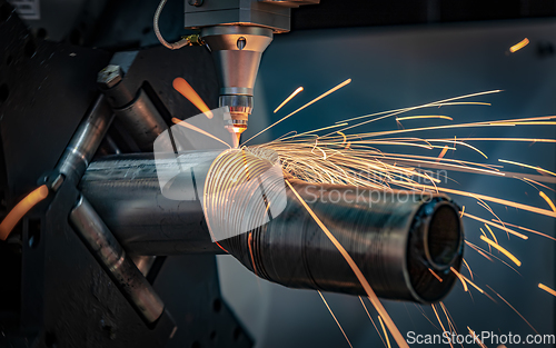 Image of CNC Laser cutting of metal, modern industrial technology.