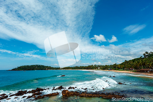 Image of Mirissa beach in Sri Lanka in daytime with clouds
