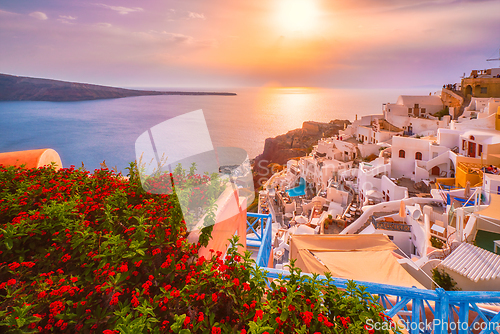 Image of Sunset over Oia town on Santorini island in summer. Santorini, Greece