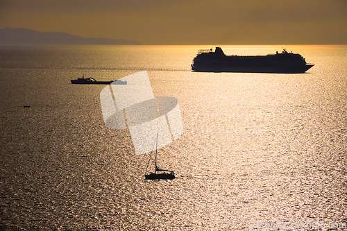 Image of Cruise ship silhouette in Aegean sea on sunset