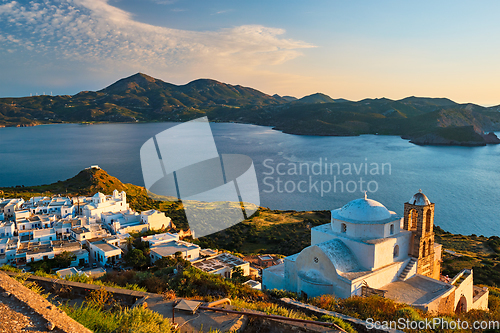 Image of Greek Orthodox church in Plaka village on Milos island on sunset in Greece