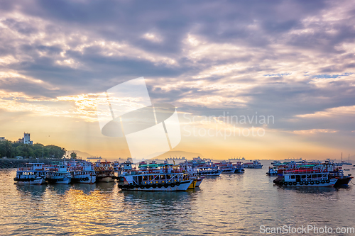 Image of Tourist boats in sea on sunrise in Mumbai, India