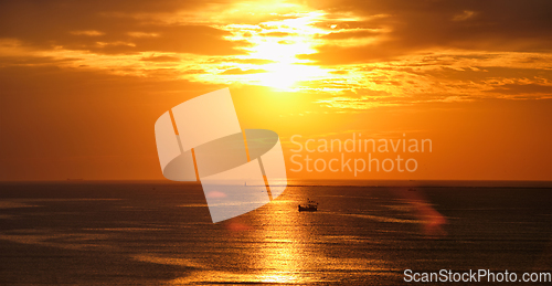 Image of Sea sunset with boats