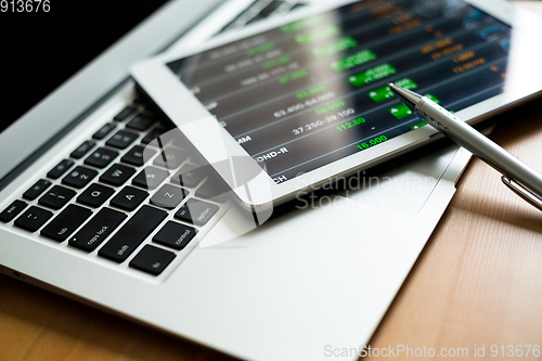 Image of Stock exchange office with tablet pc