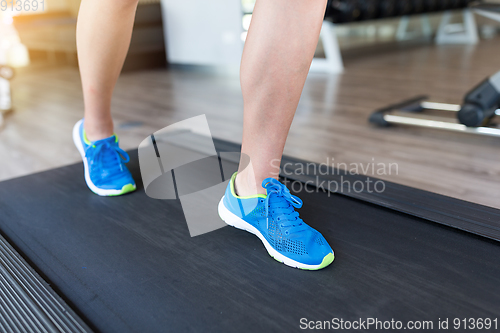 Image of Woman running on treadmill