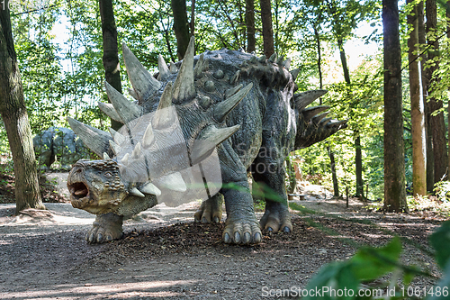 Image of prehistoric dinosaur like stegosaurus in nature