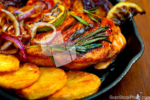 Image of roasted grilled BBQ chicken breast with herbs and spices
