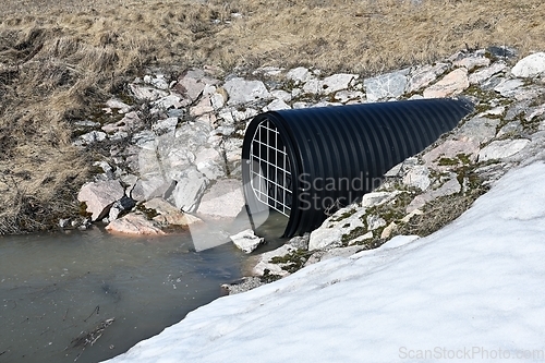 Image of plastic corrugated drainage pipe with grate