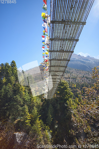 Image of Suspension bridge over the river in Himalayas