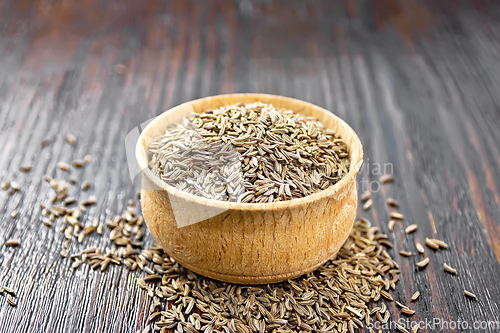 Image of Cumin seeds in bowl on board