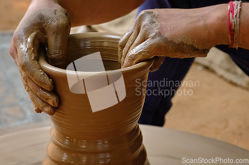 Image of Indian potter hands at work, Shilpagram, Udaipur, Rajasthan, India