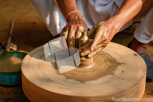 Image of Indian potter hands at work, Shilpagram, Udaipur, Rajasthan, India