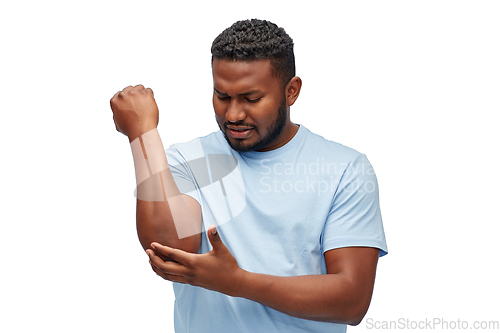 Image of african american man suffering from pain in hand