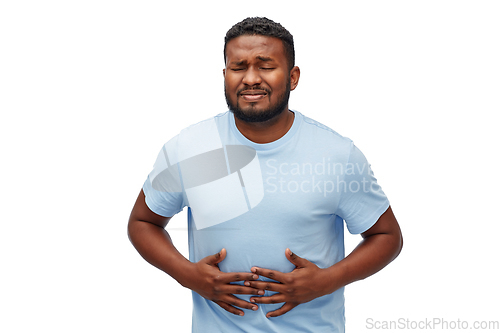 Image of unhappy man suffering from stomach ache