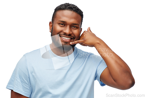 Image of african american man making phone call gesture