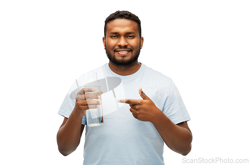 Image of happy african man with water in glass bottle