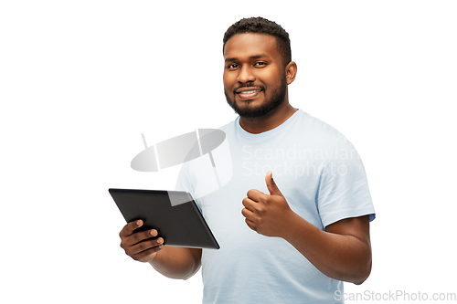 Image of happy african american man with tablet computer