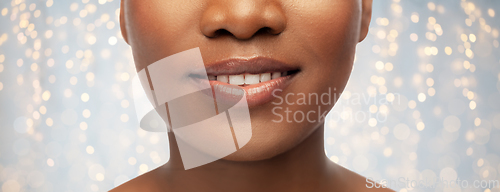 Image of close up of face of smiling african american woman