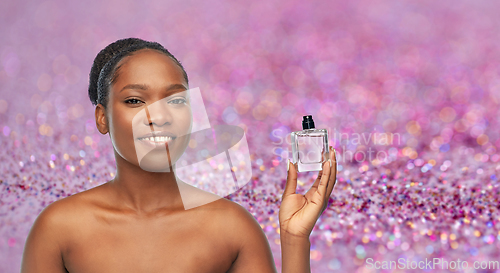 Image of young african american woman with perfume