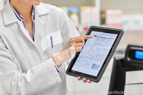 Image of pharmacist with prescription on tablet pc
