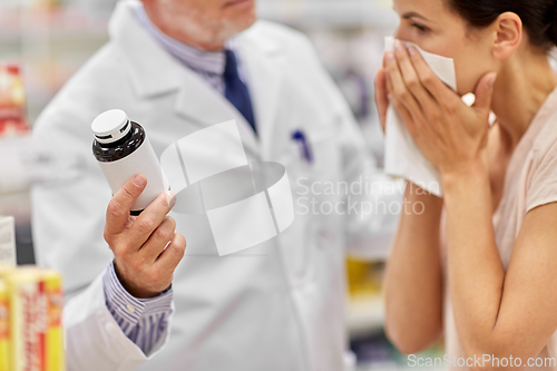 Image of apothecary shows medicine to ill woman at pharmacy