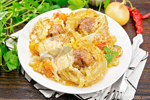 Image of Pasta with meatballs in plate on board