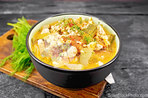 Image of Ragout of zucchini and minced meat in bowl on board