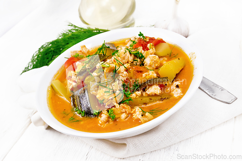 Image of Ragout of zucchini and minced meat in plate on board