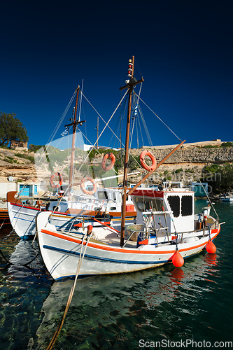 Image of Fishing boats in harbour in fishing village of Mandrakia, Milos island, Greece