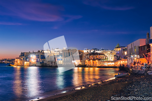 Image of Sunset in Mykonos, Greece, with cruise ship and yachts in the harbor