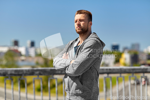 Image of portrait of young man outdoors