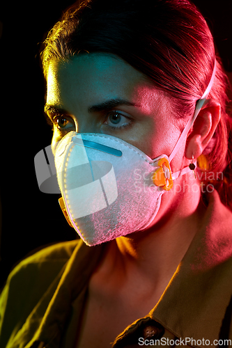 Image of young woman wearing protective mask or respirator