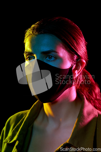 Image of young woman wearing reusable protective mask