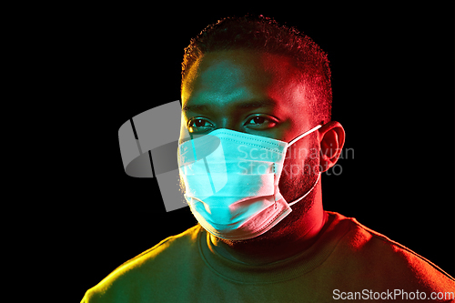 Image of african american man wearing medical mask