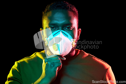 Image of african american man in mask or respirator