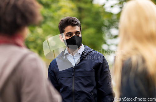 Image of indian man in reusable mask at park