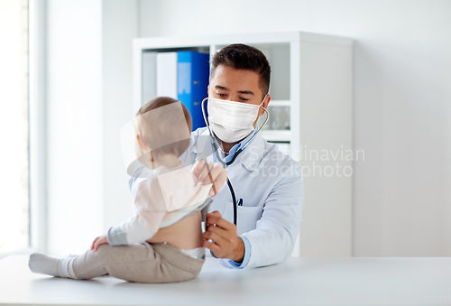 Image of doctor in mask with stethoscope and baby at clinic
