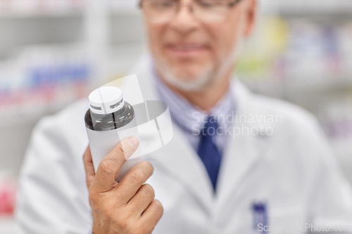 Image of close up of pharmacist with medicine at pharmacy