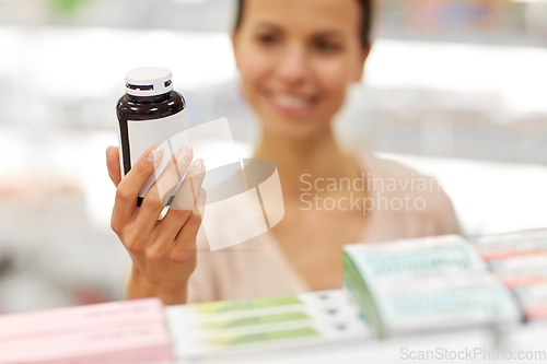 Image of close up of customer choosing medicine at pharmacy