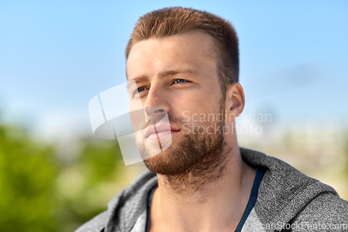Image of portrait of young man outdoors