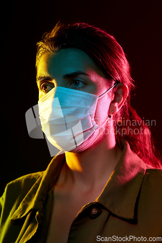 Image of young woman wearing protective medical mask