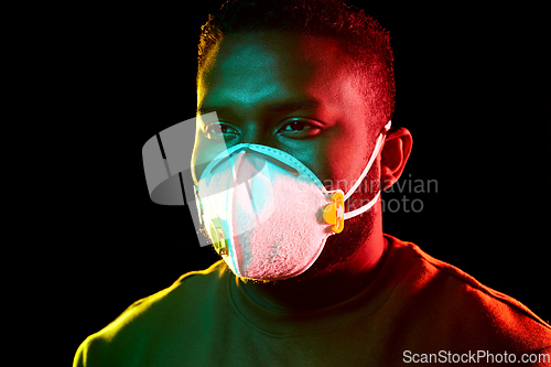 Image of african american man in mask or respirator