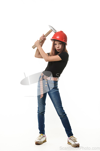 Image of A girl in a hard hat hit her hard hat with a hammer, a malicious expression on her face