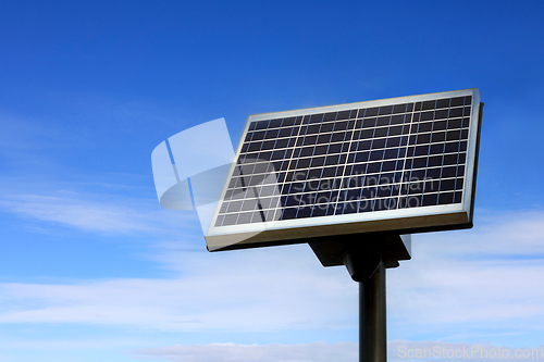 Image of Small Solar Panel against Blue Sky