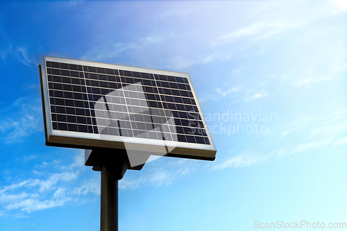 Image of Small Solar Panel against Blue Sky