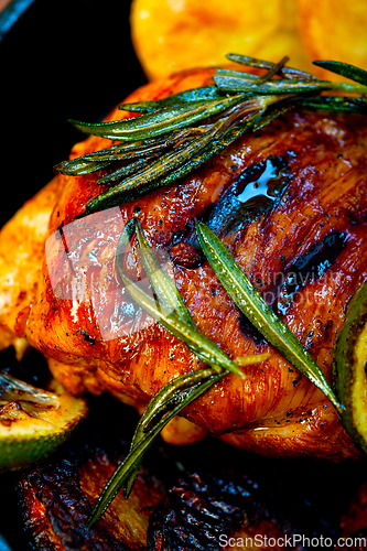 Image of roasted grilled BBQ chicken breast with herbs and spices